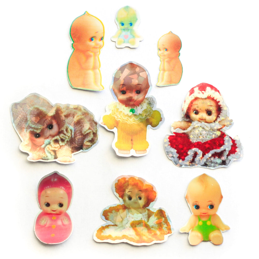A collection of various Kewpie stickers featuring different designs, predominantly in pastel colors.